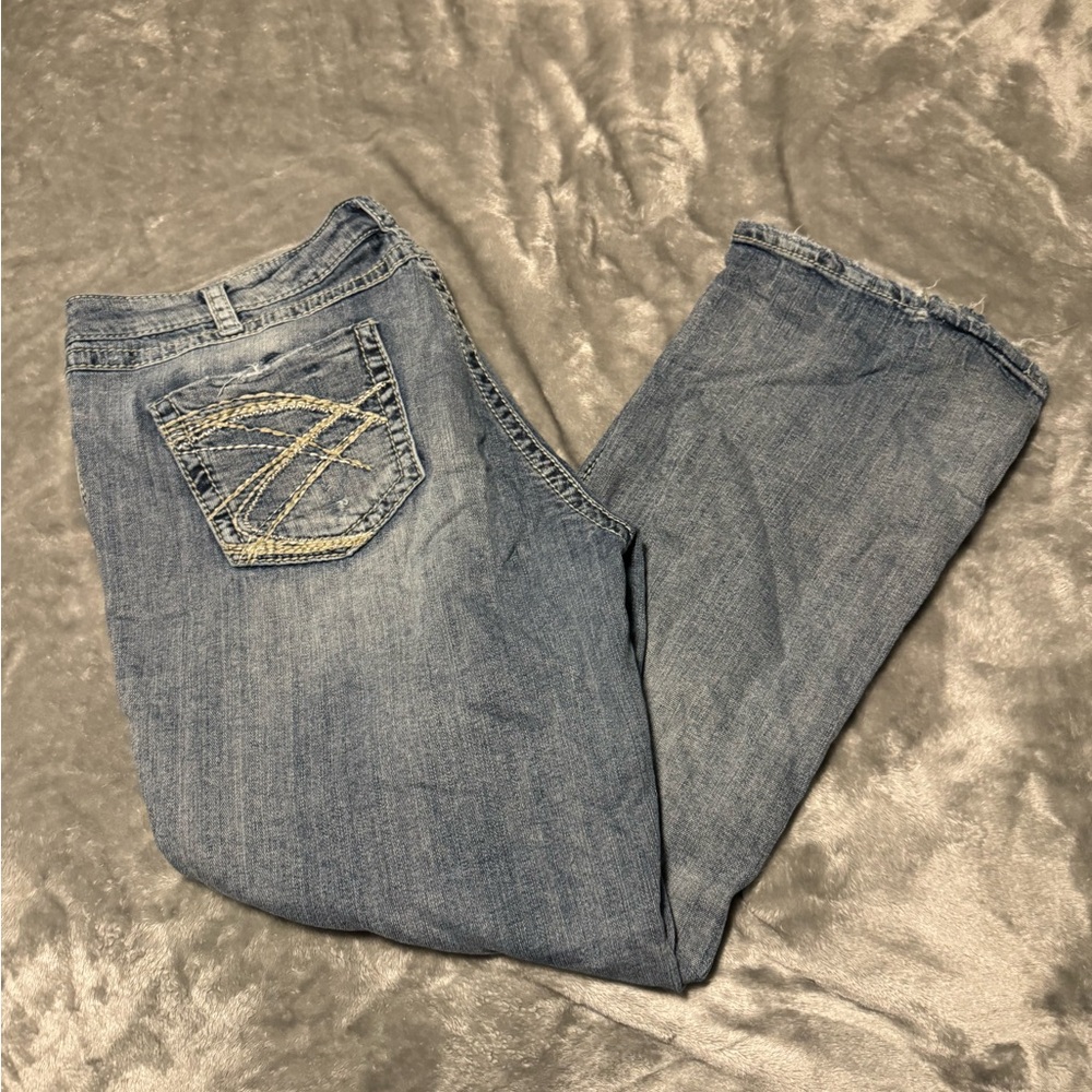 Silver Jeans Blue Twisted Boot Cut Denim with Embroidered Details